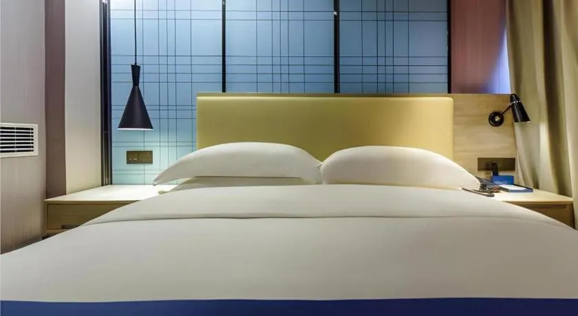 Bed in Echarm Hotel Guiyang Qianling Mountain