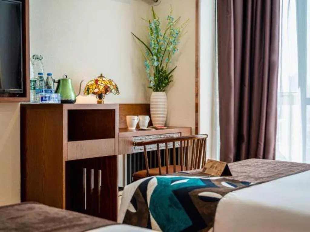 Bed in James Joyce Coffetel Guilin Railway Station Xiangbi Mountain Liangjiang Sihu Wharf