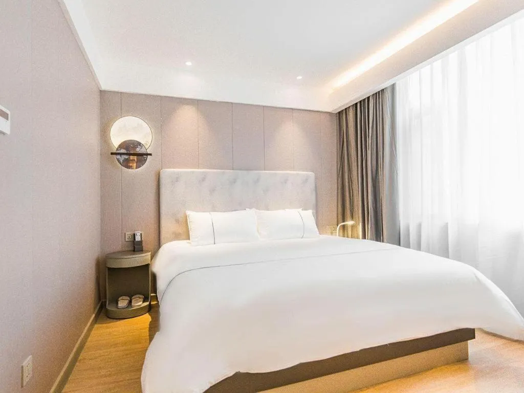 Bed in Magnotel Hotel Huangshan Scenic Area Transfer Center