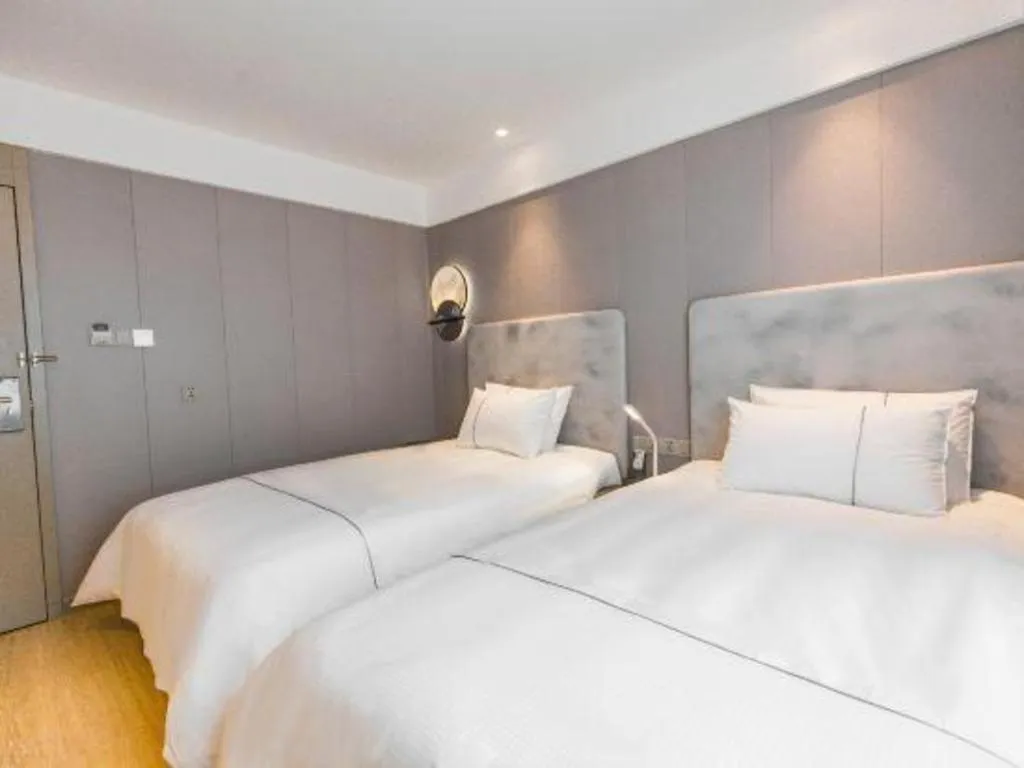 Bed in Magnotel Hotel Huangshan Scenic Area Transfer Center