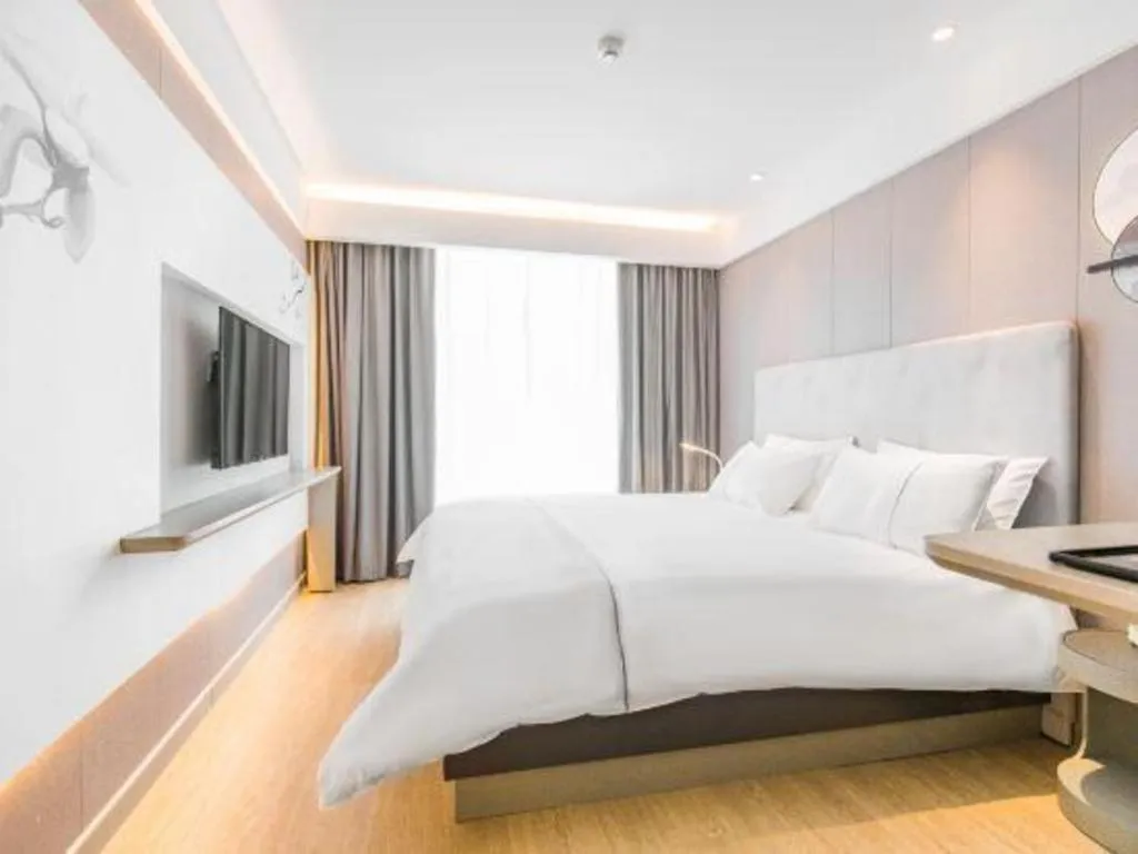 Bed in Magnotel Hotel Huangshan Scenic Area Transfer Center