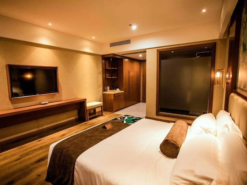 Bed in James Joyce Coffetel Xinyang Municipal Government Railway Station