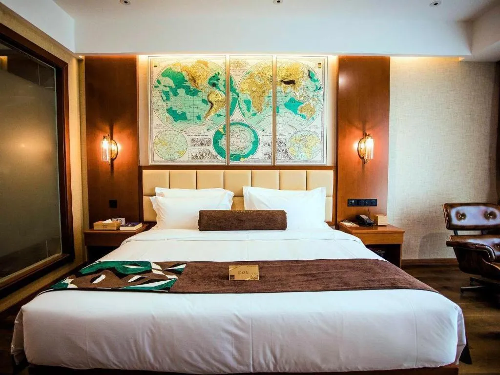 Bed in James Joyce Coffetel Xinyang Municipal Government Railway Station