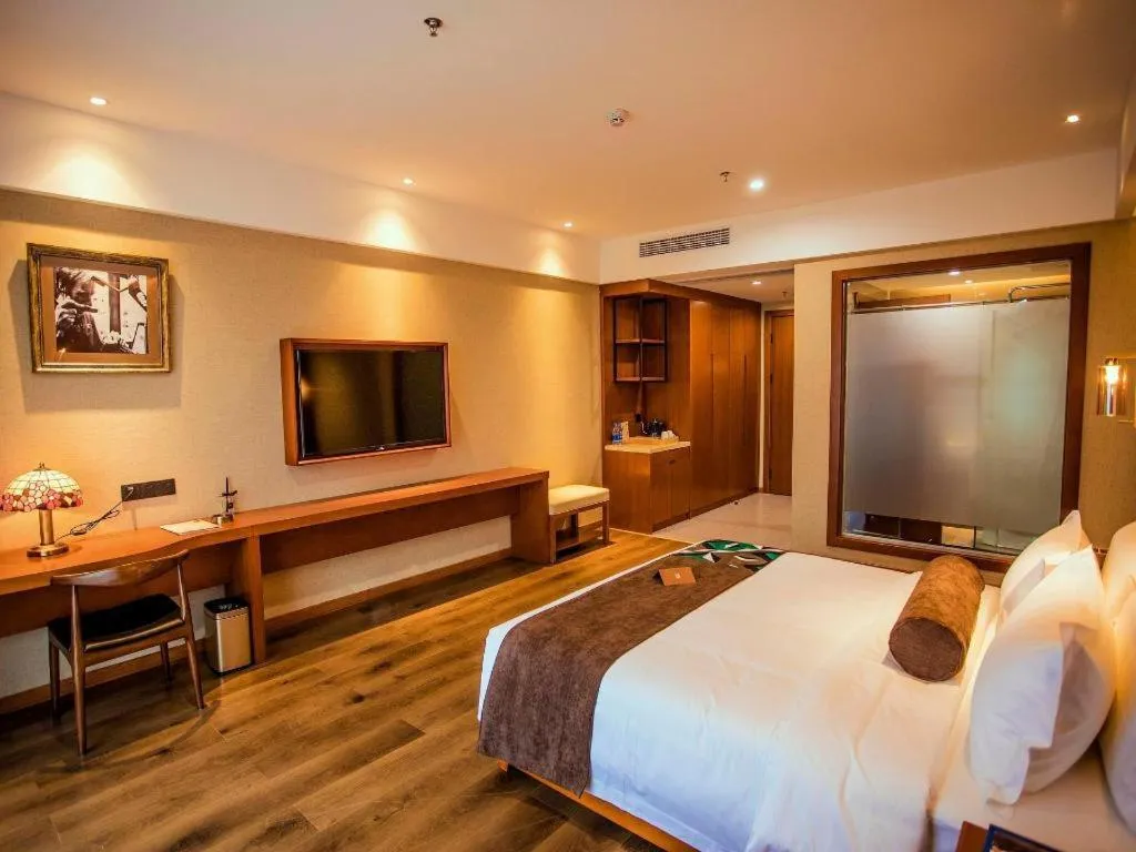 Bed in James Joyce Coffetel Xinyang Municipal Government Railway Station