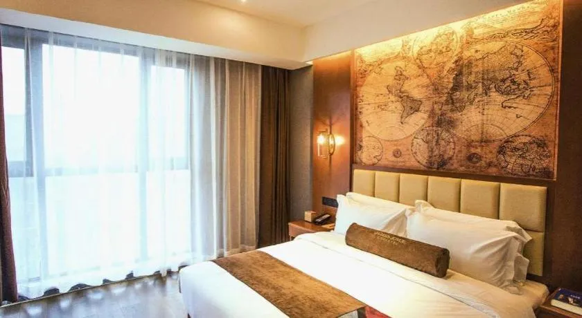 Bed in James Joyce Coffetel Xinyang Municipal Government Railway Station