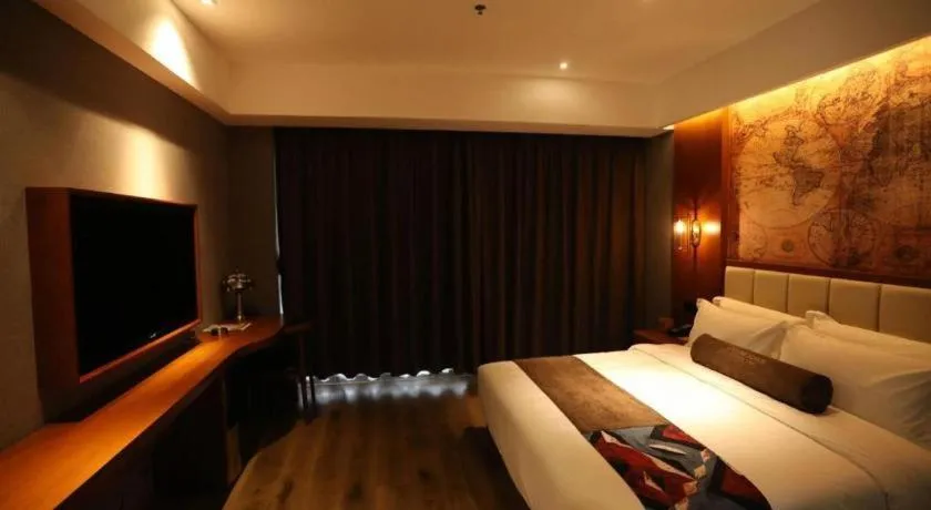 Bed in James Joyce Coffetel Xinyang Municipal Government Railway Station