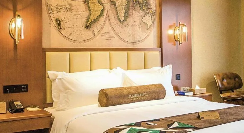 Bed in James Joyce Coffetel Xinyang Municipal Government Railway Station