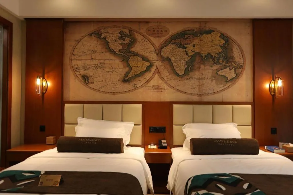 Bed in James Joyce Coffetel Xinyang Municipal Government Railway Station