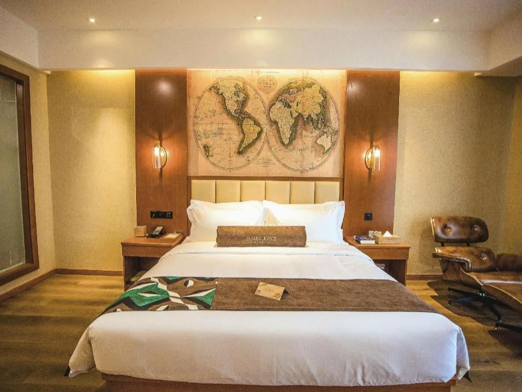 Bed in James Joyce Coffetel Xinyang Municipal Government Railway Station