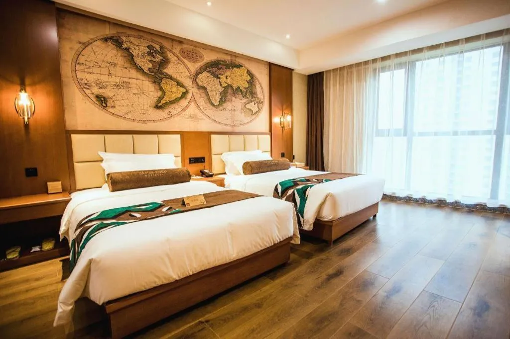 Bed in James Joyce Coffetel Xinyang Municipal Government Railway Station