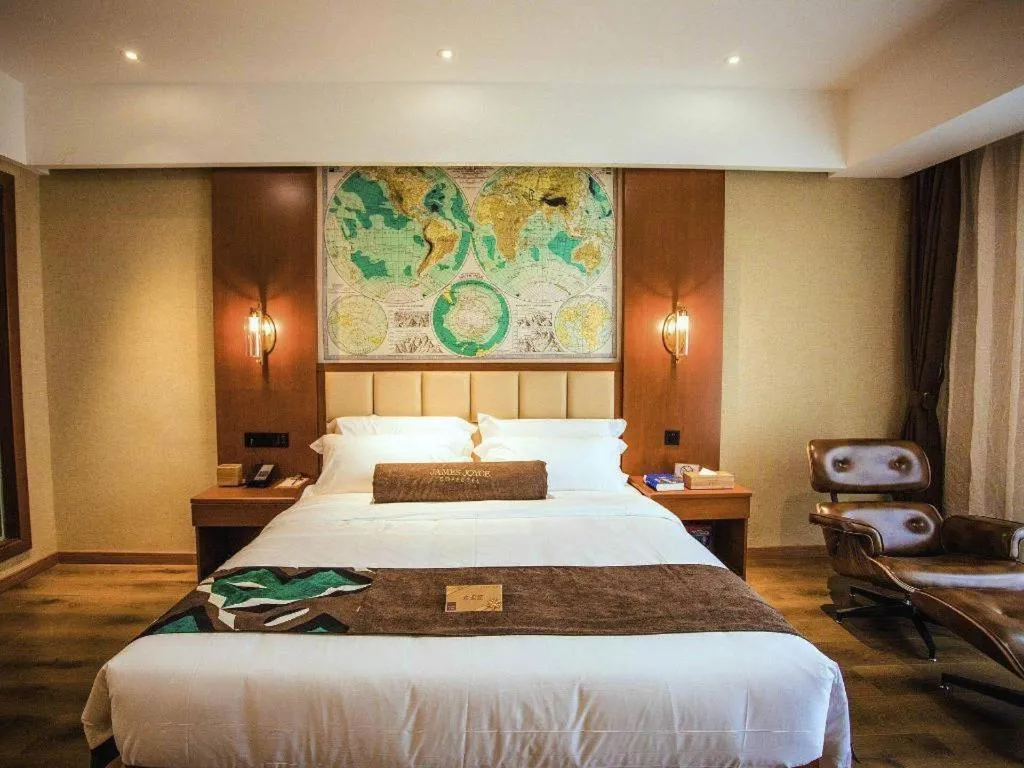 Bed in James Joyce Coffetel Xinyang Municipal Government Railway Station