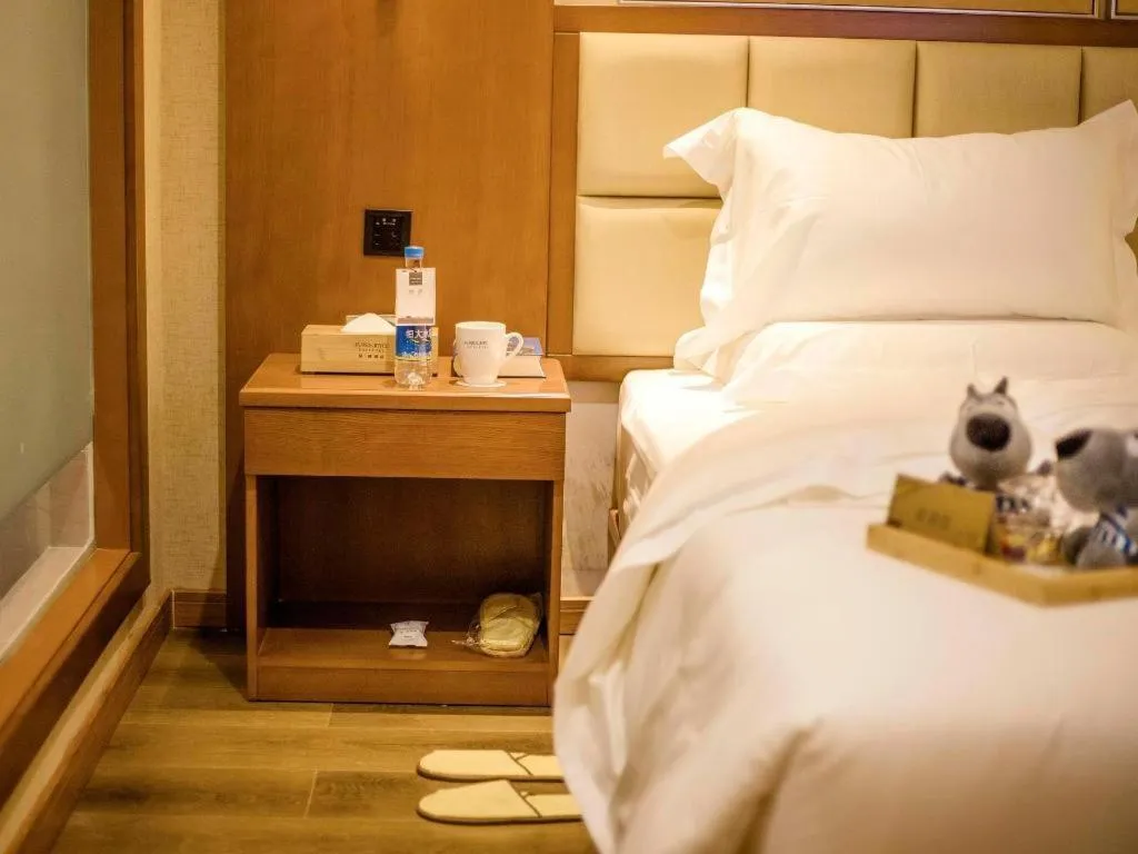 Bed in James Joyce Coffetel Xinyang Municipal Government Railway Station