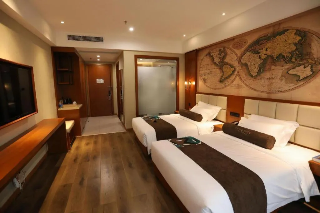 Bed in James Joyce Coffetel Xinyang Municipal Government Railway Station