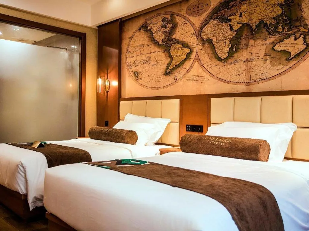 Bed in James Joyce Coffetel Xinyang Municipal Government Railway Station