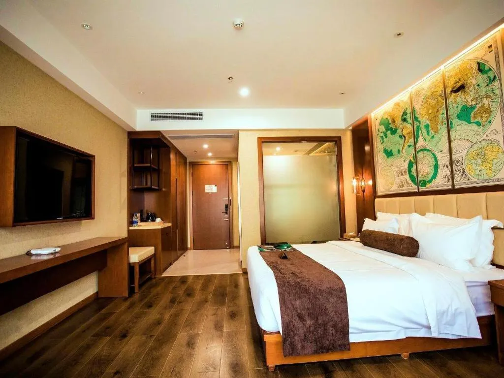 Bed in James Joyce Coffetel Xinyang Municipal Government Railway Station