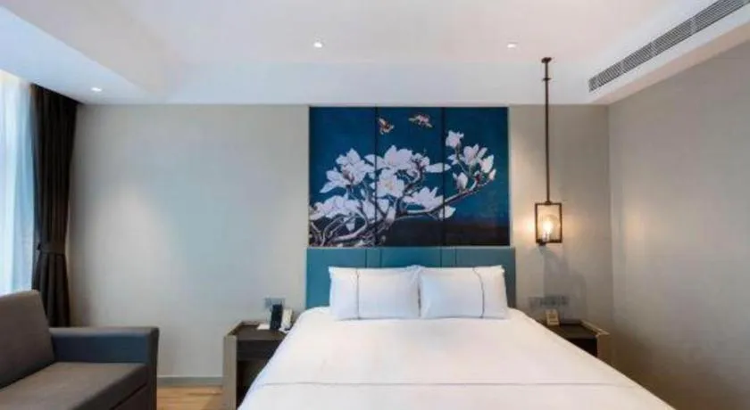 Bed in Magnotel Hotel Guangyuan Nanhe Bus Station Beijing Road