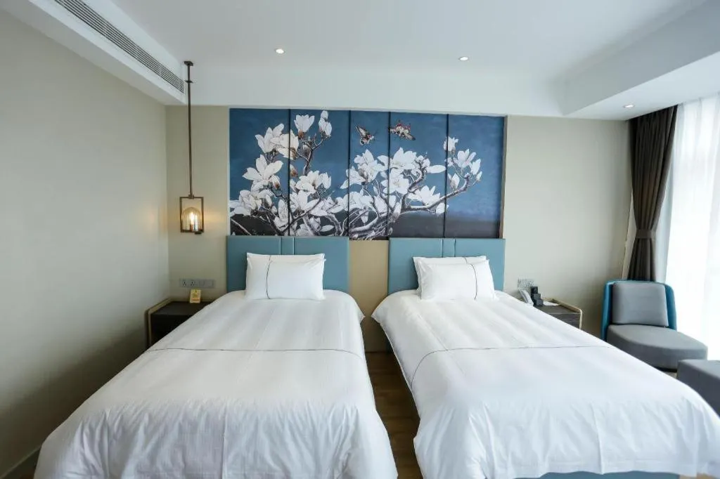 Bed in Magnotel Hotel Guangyuan Nanhe Bus Station Beijing Road