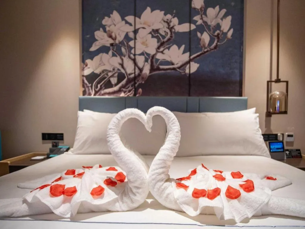 Bed in Magnotel Hotel Guangyuan Nanhe Bus Station Beijing Road