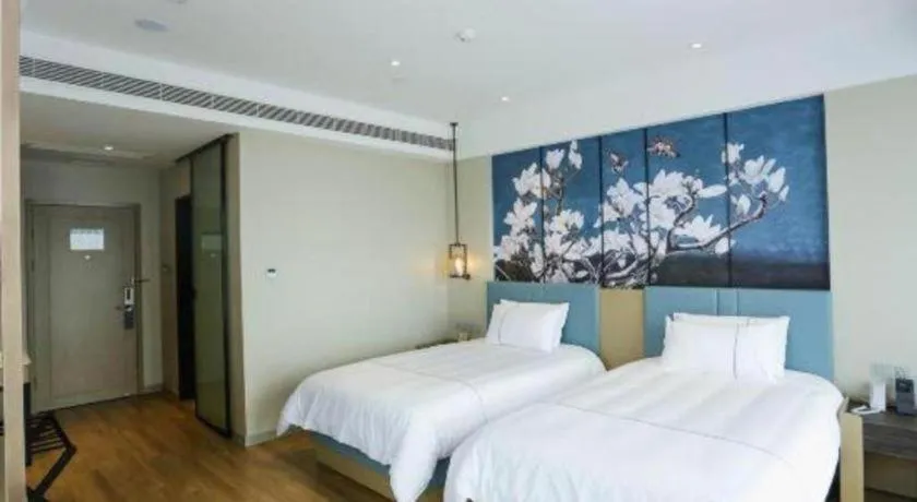 Bed in Magnotel Hotel Guangyuan Nanhe Bus Station Beijing Road