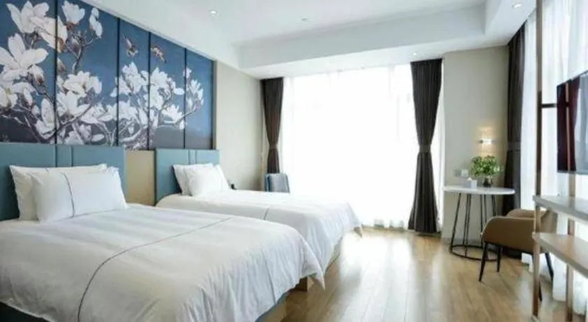 Bed in Magnotel Hotel Guangyuan Nanhe Bus Station Beijing Road