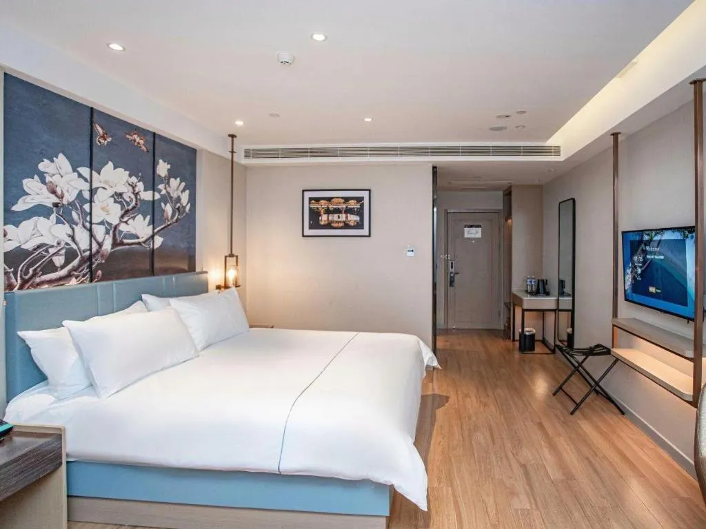 Bed in Magnotel Hotel Guangyuan Nanhe Bus Station Beijing Road