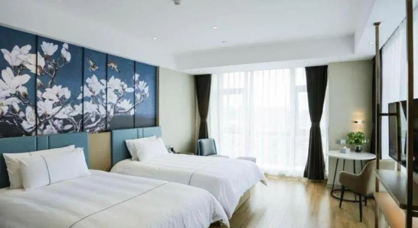 Bed in Magnotel Hotel Guangyuan Nanhe Bus Station Beijing Road