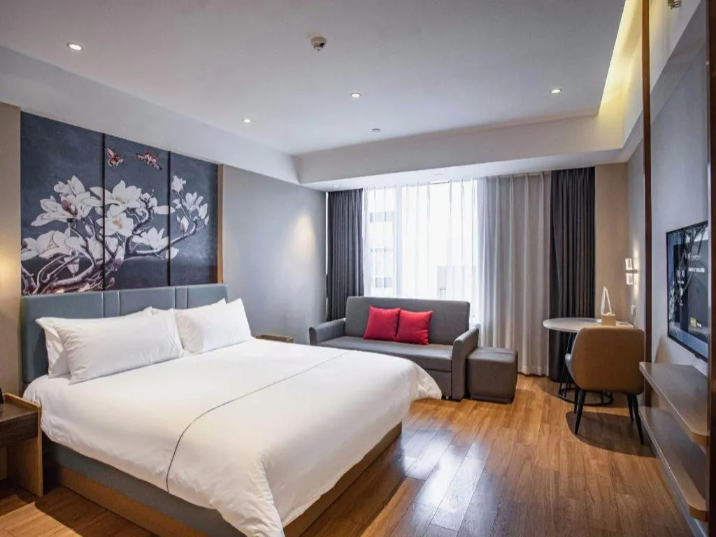 Bed in Magnotel Hotel Guangyuan Nanhe Bus Station Beijing Road