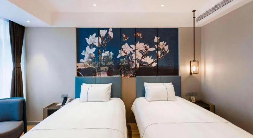 Bed in Magnotel Hotel Guangyuan Nanhe Bus Station Beijing Road