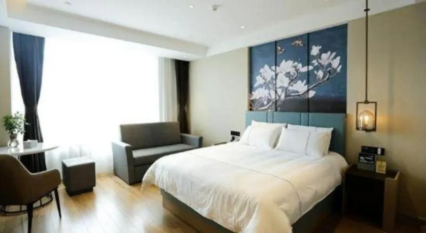 Bed in Magnotel Hotel Guangyuan Nanhe Bus Station Beijing Road