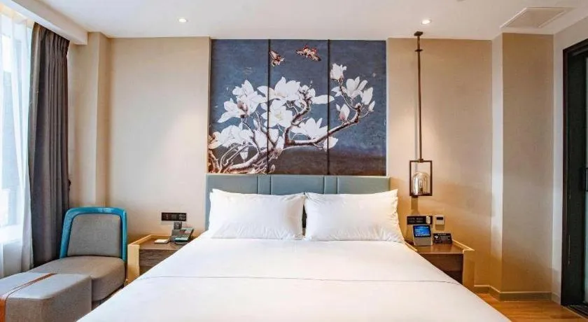 Bed in Magnotel Hotel Guangyuan Nanhe Bus Station Beijing Road