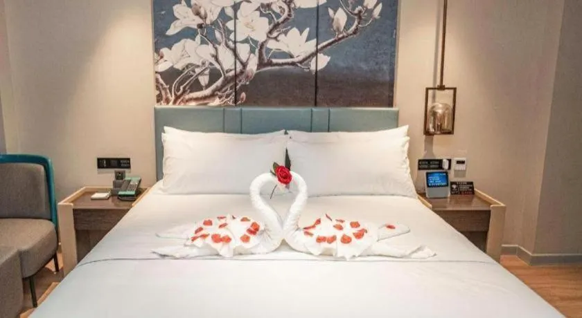 Bed in Magnotel Hotel Guangyuan Nanhe Bus Station Beijing Road