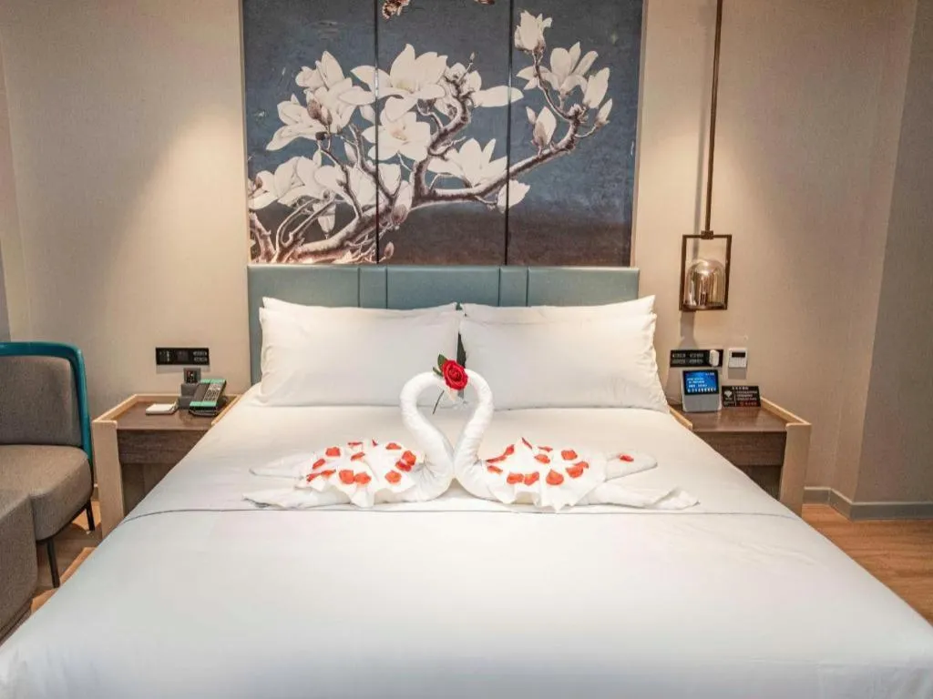 Bed in Magnotel Hotel Guangyuan Nanhe Bus Station Beijing Road