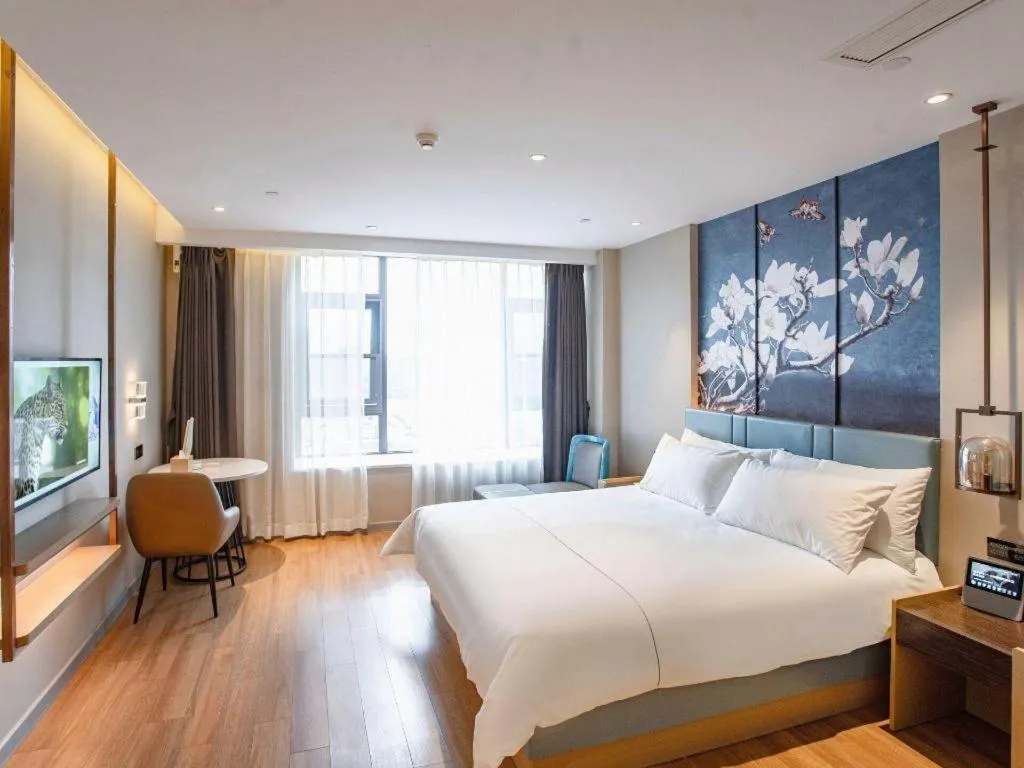 Bed in Magnotel Hotel Guangyuan Nanhe Bus Station Beijing Road