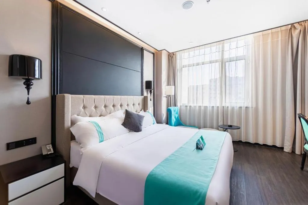 Bed in Xana Hotelle Binzhou Yangxin