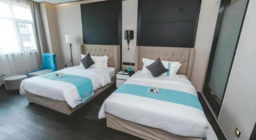 Bed in Xana Hotelle Binzhou Yangxin