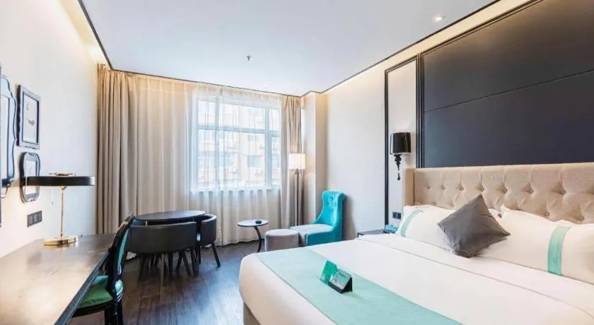 Bed in Xana Hotelle Binzhou Yangxin