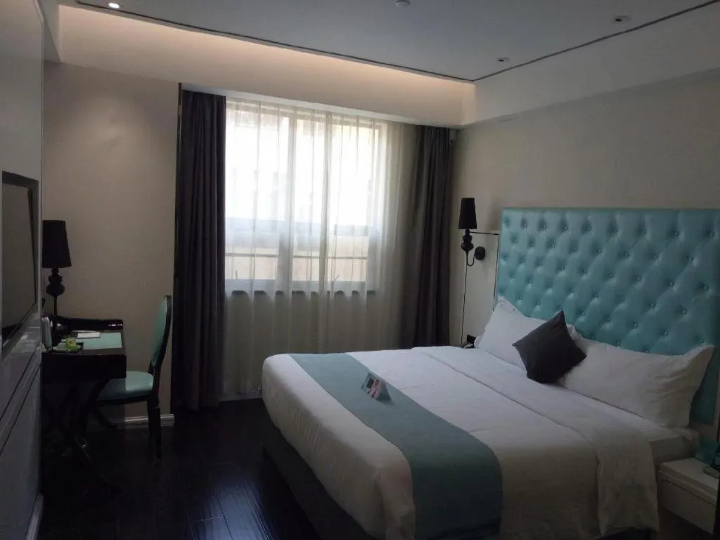 Bed in Xana Hotelle Binzhou Yangxin