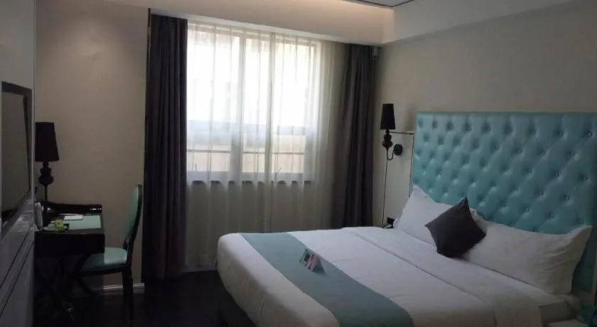 Bed in Xana Hotelle Binzhou Yangxin