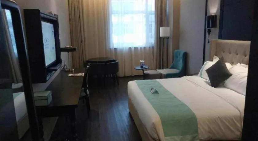 Bed in Xana Hotelle Binzhou Yangxin