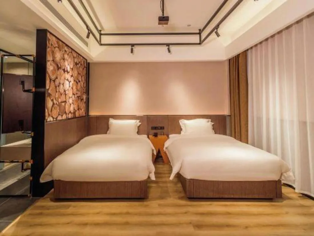 Bed in ZMAX Hotel Yan'an Baimi Avenue Baotashan
