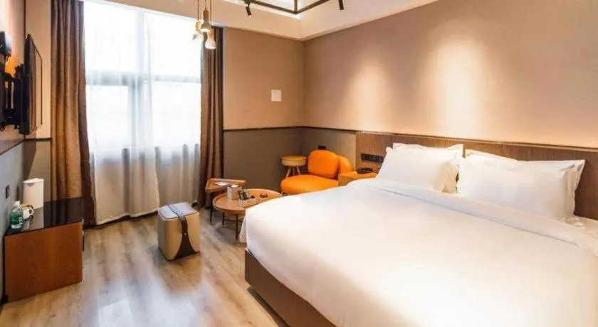 Bed in ZMAX Hotel Yan'an Baimi Avenue Baotashan