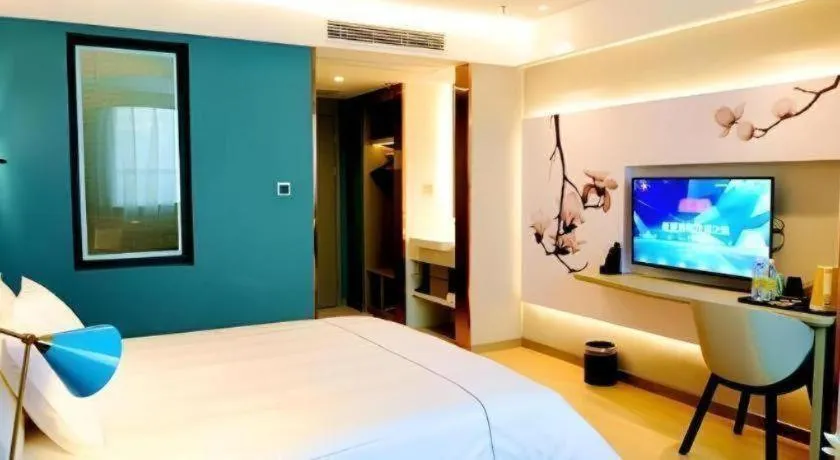 Bed in Magnotel Hotel Xuzhou Xinxin Yurun Plaza Zhongwu Road