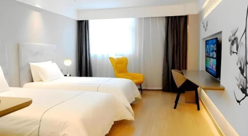 Bed in Magnotel Hotel Xuzhou Xinxin Yurun Plaza Zhongwu Road