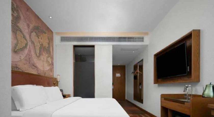 Bed in James Joyce Coffetel Luoyang Longmen High-speed Railway Station Baolong Plaza