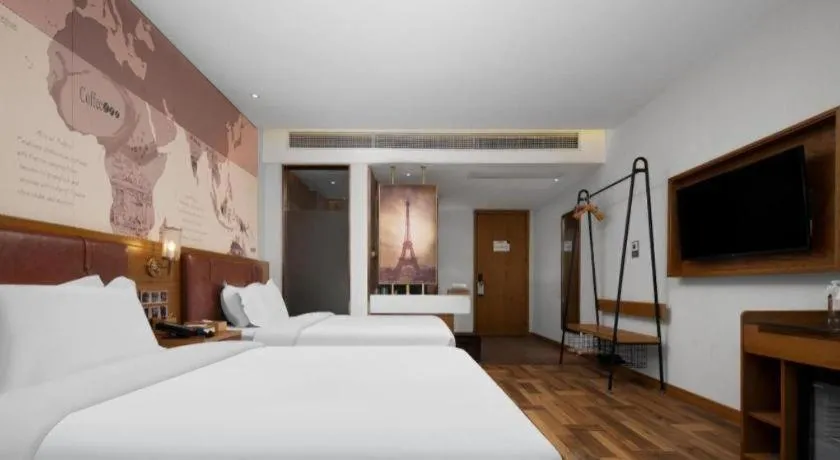 Bed in James Joyce Coffetel Luoyang Longmen High-speed Railway Station Baolong Plaza