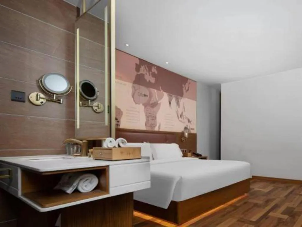 Bed in James Joyce Coffetel Luoyang Longmen High-speed Railway Station Baolong Plaza