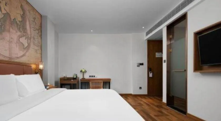 Bed in James Joyce Coffetel Luoyang Longmen High-speed Railway Station Baolong Plaza