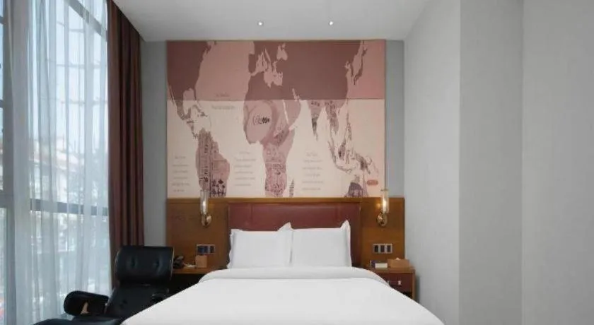 Bed in James Joyce Coffetel Luoyang Longmen High-speed Railway Station Baolong Plaza