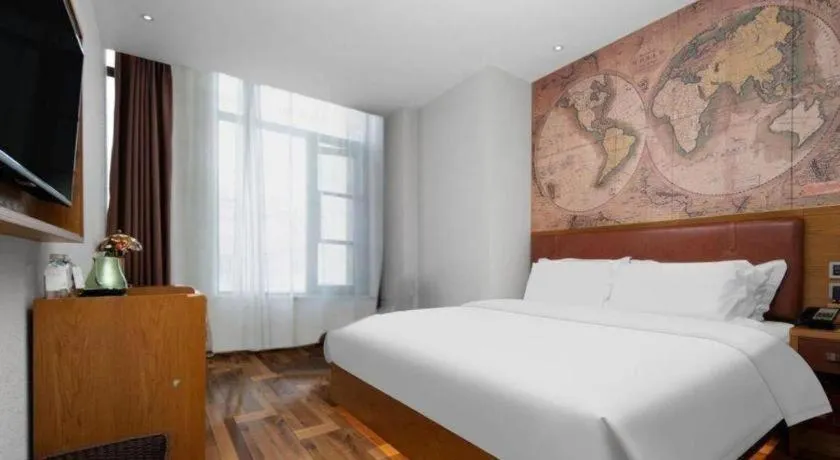 Bed in James Joyce Coffetel Luoyang Longmen High-speed Railway Station Baolong Plaza