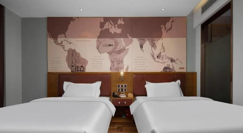 Bed in James Joyce Coffetel Luoyang Longmen High-speed Railway Station Baolong Plaza